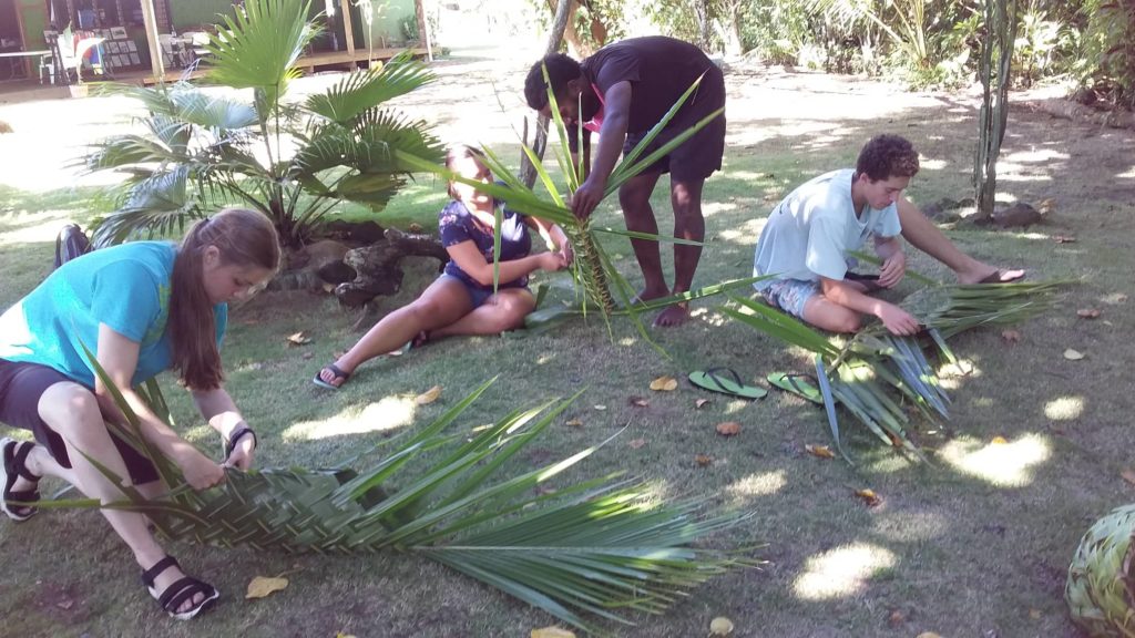 Great fun weaving traditional baskets for the lovo